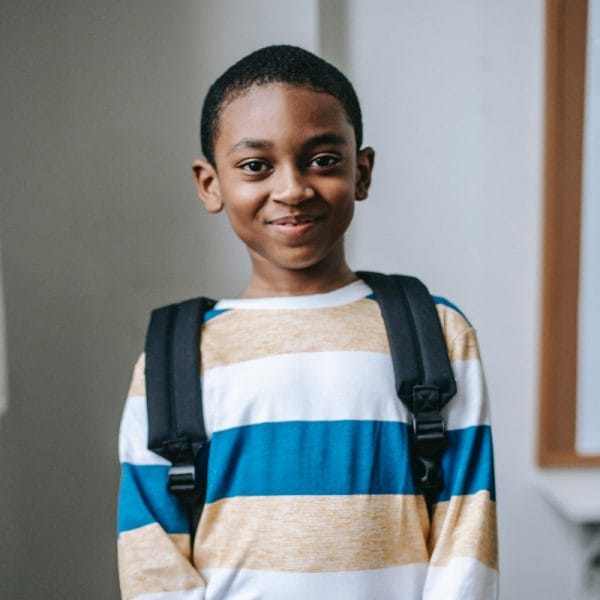 smiling child with backpack